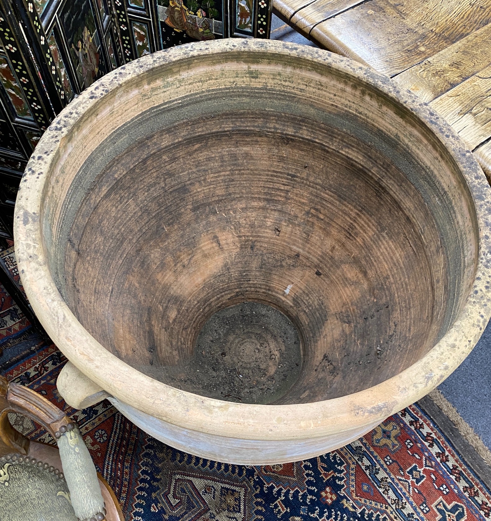 A large Grecian style circular earthenware garden planter diameter 80cm, height 80cm